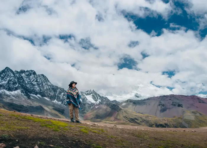 Traveler exploring high-Andean landscapes during the Ausangate Luxury Glamping Trek