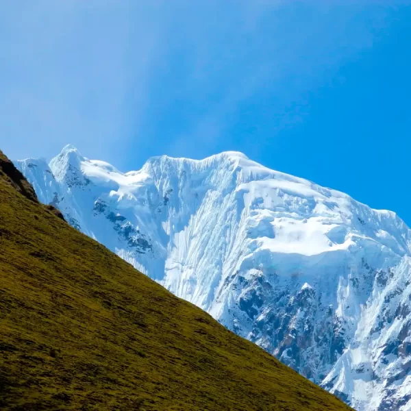 Green Andean mountains and snowy peaks along the Salkantay Luxury Glamping Trek 5 Days