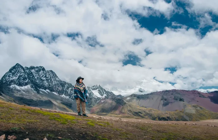 Traveler exploring high-Andean landscapes during the Ausangate Luxury Glamping Trek