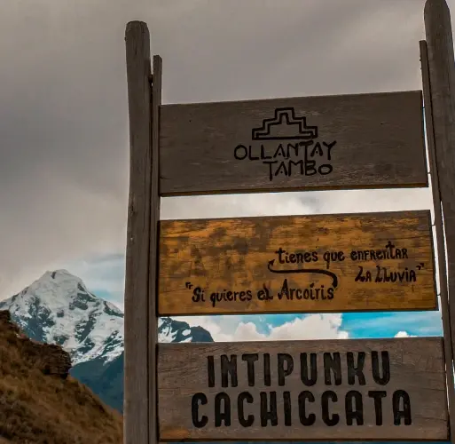 Trail sign to Intipunku Cachicata Wooden trail sign pointing to Intipunku Cachicata near Ollantaytambo in the Andes