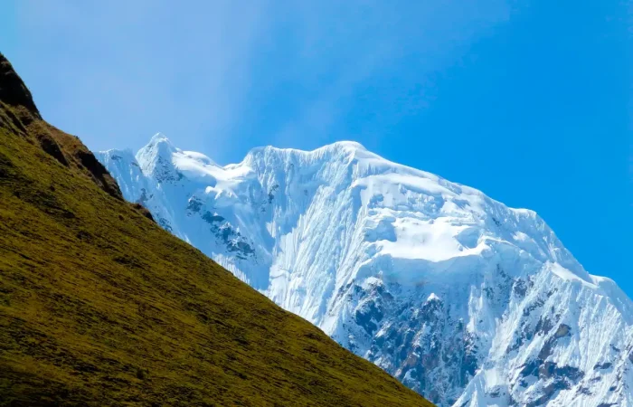 Green Andean mountains and snowy peaks along the Salkantay Luxury Glamping Trek 5 Days