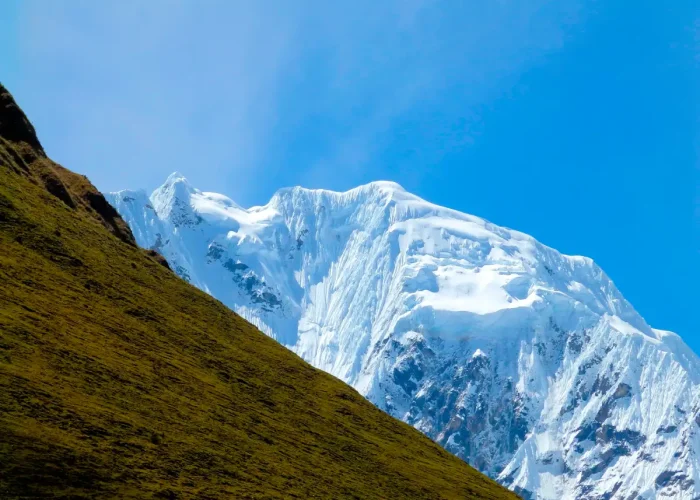 Green Andean mountains and snowy peaks along the Salkantay Luxury Glamping Trek 5 Days