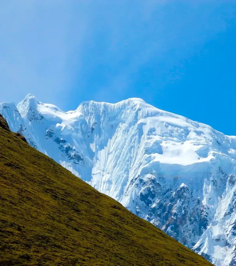 Green Andean mountains and snowy peaks along the Salkantay Luxury Glamping Trek 5 Days