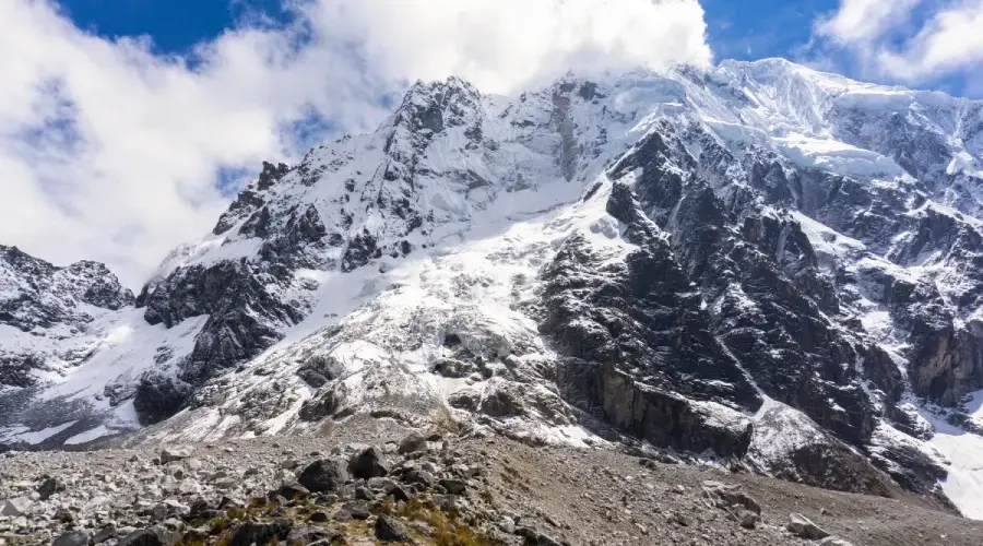 Snow-covered Salkantay mountain under a blue sky in the Andes