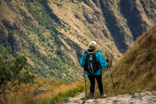 Traveler packing backpack for the Inca Trail to Machu Picchu