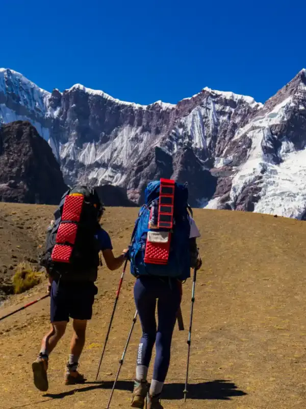 Hikers on the Ausangate Luxury Glamping Trek surrounded by the snow-capped Andes