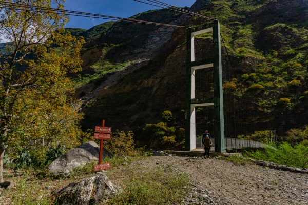 Suspension bridge and mountain trail leading toward Marampata and Choquequirao