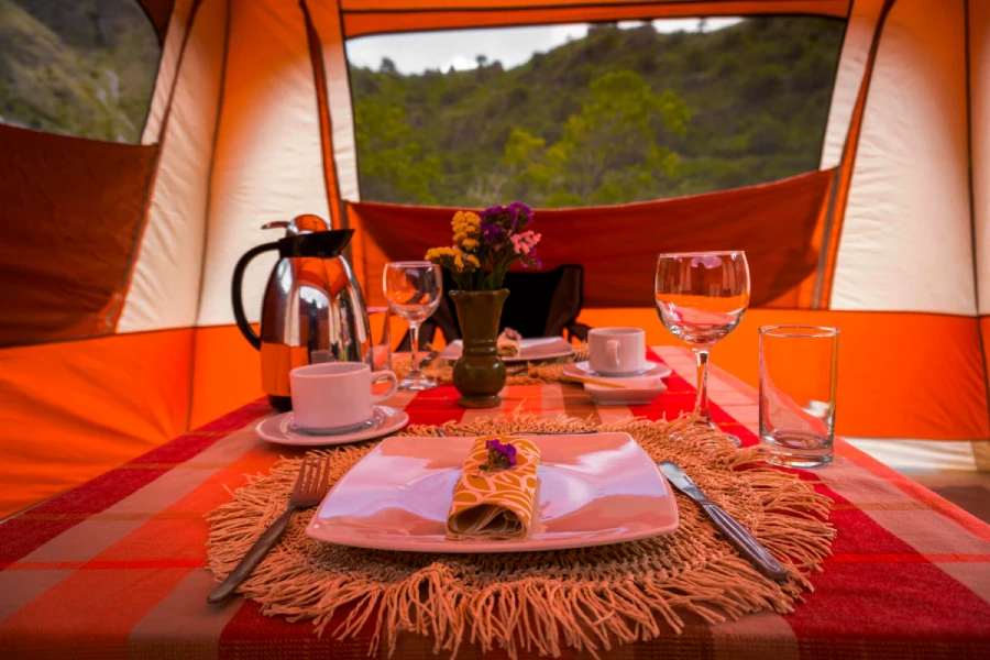 Gourmet Dining in a Luxury Camp Gourmet meal served inside a luxury camp in the Andes