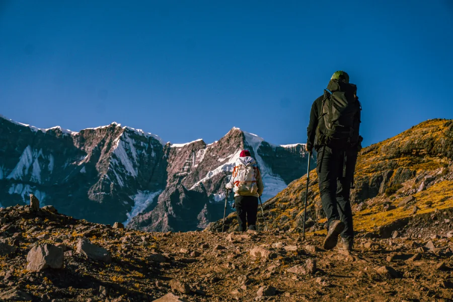 Hikers ascending a high mountain trail in the Ausangate region of Peru