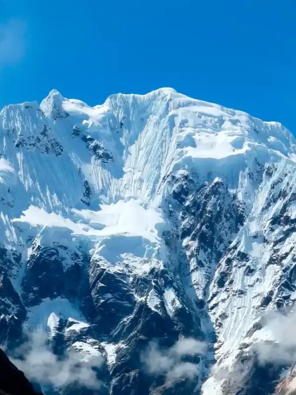 Luxury Salkantay Trek to Machu Picchu with dramatic snow-capped mountains in the Peruvian Andes