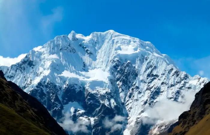 Luxury Salkantay Trek to Machu Picchu with dramatic snow-capped mountains in the Peruvian Andes