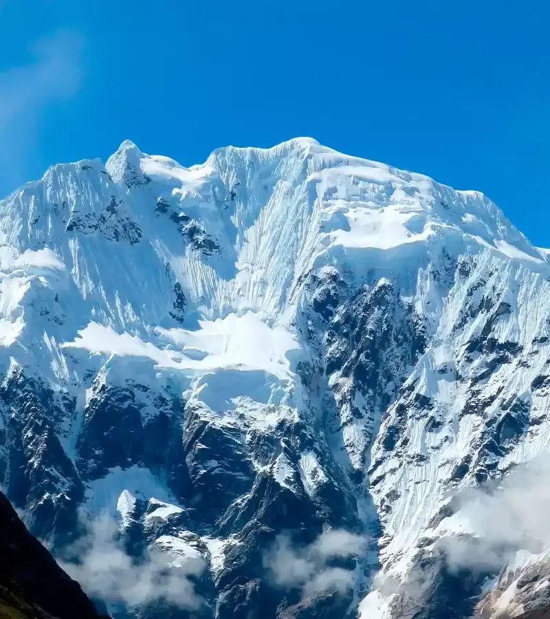 Luxury Salkantay Trek to Machu Picchu with dramatic snow-capped mountains in the Peruvian Andes