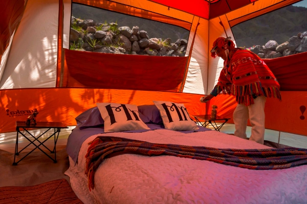 Spacious Luxury Camping Tents Spacious luxury camping tent with comfortable bedding in the Andes