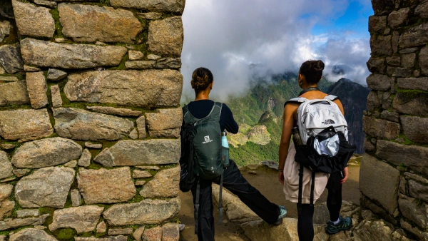 Sun Gate on the Inca Trail Hikers approaching the Sun Gate with mountain views