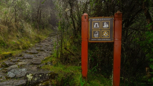 Traveler exploring archaeological sites along the Inca Trail