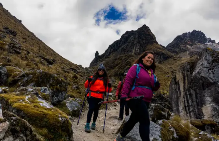 Hiking Through Rocky Trails in the Peruvian Andes Trekking difficulty in Peru illustrated by hikers navigating a rocky mountain trail in the Andes